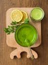 Invigorating green juice with lemon and parsley for a refreshing detox boost.